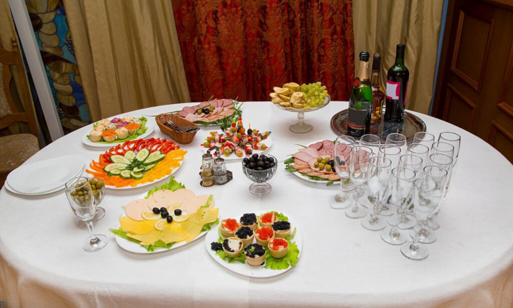 Dinner table with themed appetizers and drinks.