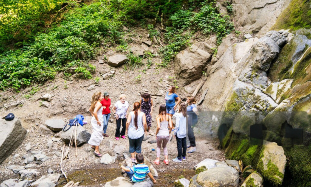 Adventure travelers receiving a safety briefing from a knowledgeable guide.